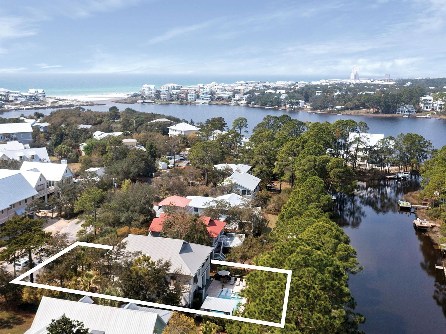 Aerial showing the property between Eastern Lake and the Gulf of Mexico, with beach access in the distance